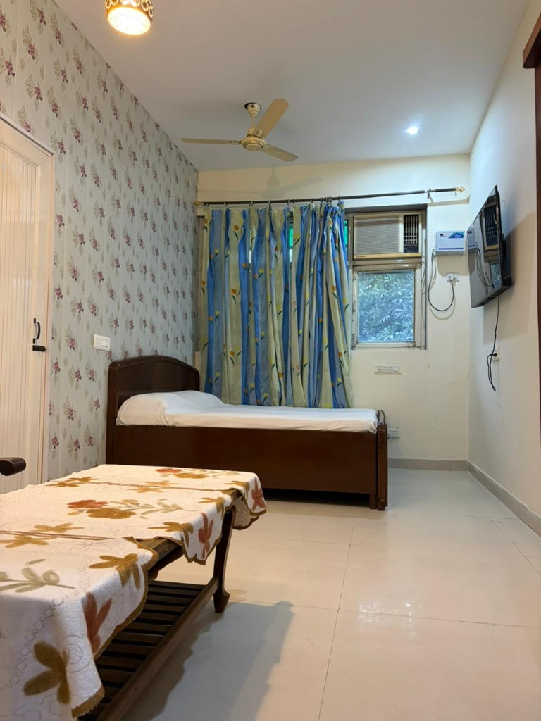 Actual senior-friendly bedroom at SixtyPlusZone with comfortable setup and natural light